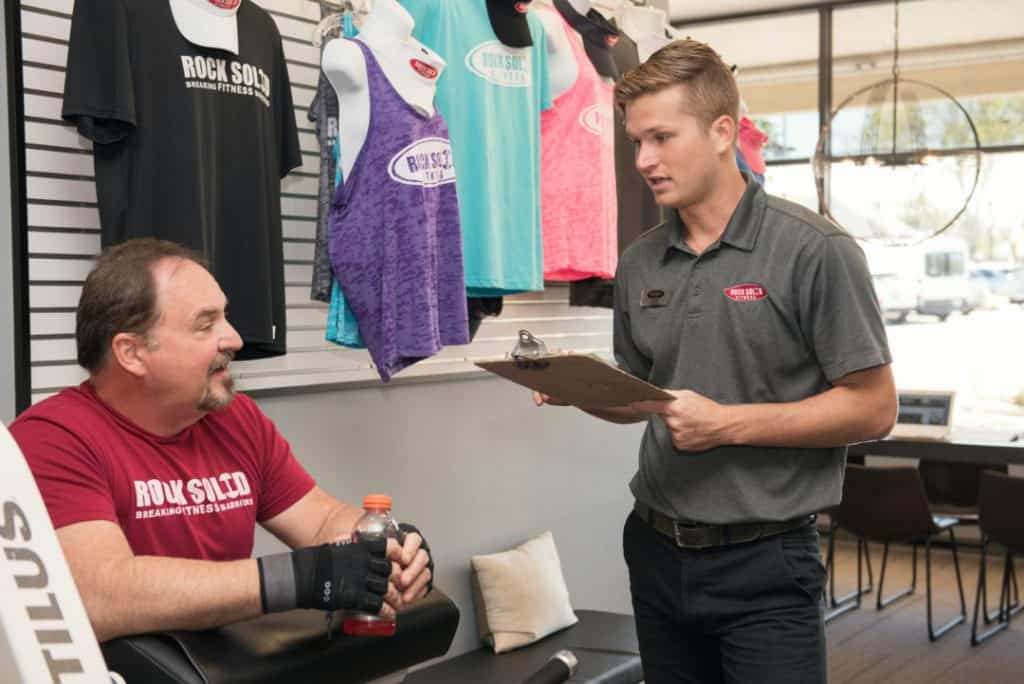 Rock Solid Fitness Trainer Discussing