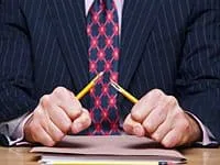Man breaking pencil