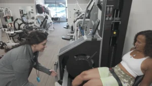 Personal trainer working with client