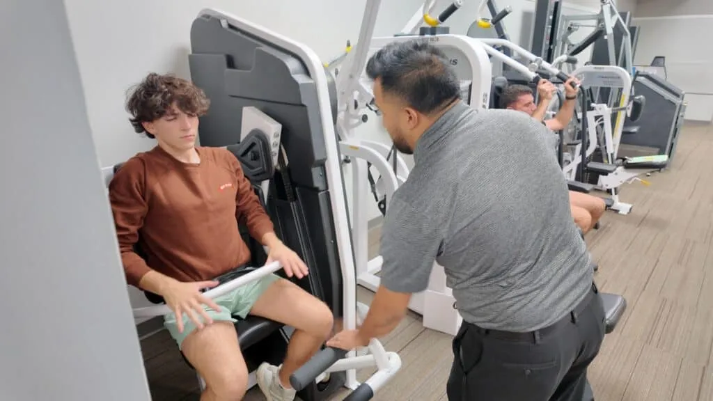 Youth Athlete Working Out On Nautilus Pullover